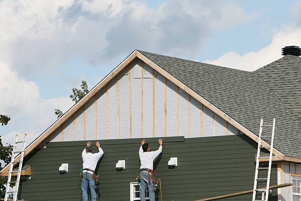 Professional Storm Damage Siding Repair technician working in Logan, WV